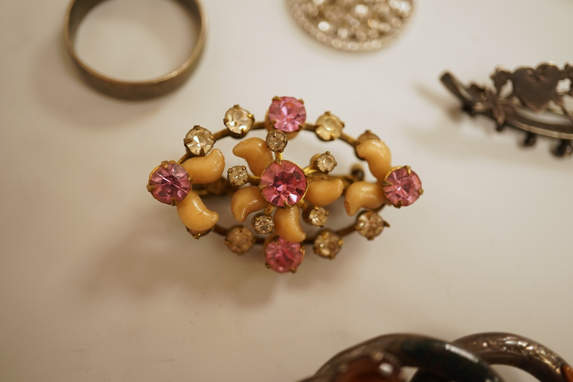 A small group of assorted jewellery including a gold plated curb link bracelet, silver brooch, simulated pearl necklace and costume.